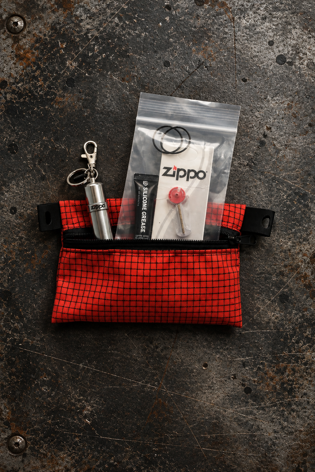 Radlight Maintenance Kit with zippered pouch, silicone grease, two replacement O-rings, Zippo flints and keychain fuel canister.